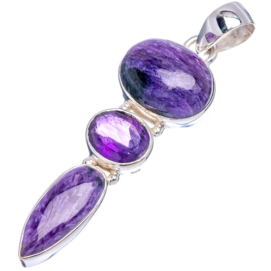 Purple gemstone pendant with arched bail, three oval and round stones in .925 sterling silver