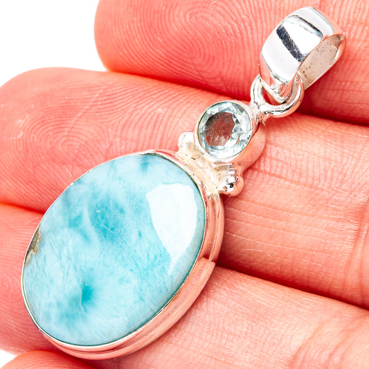 Larimar oval cabochon pendant with round blue topaz accent in sterling silver setting