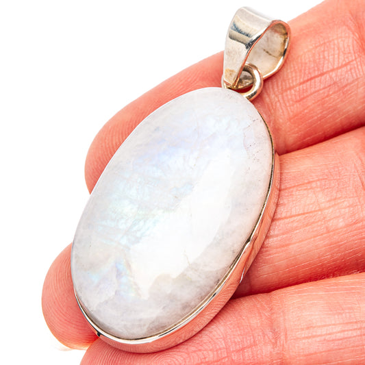 Oval rainbow moonstone pendant close-up, .925 sterling silver bail and bezel setting