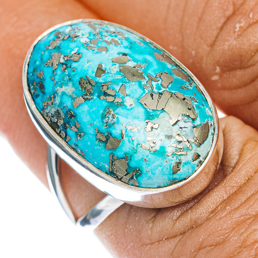 Oval turquoise cabochon sterling silver ring with metallic matrix detail