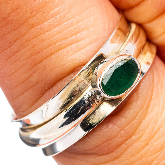 Oval green gemstone bezel ring in .925 sterling silver, close-up on bezel.