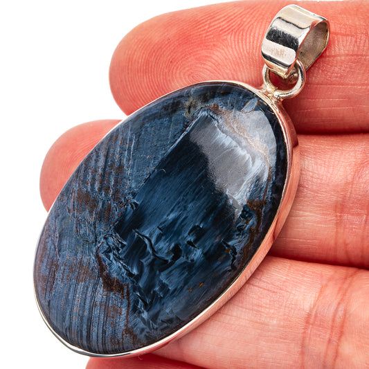 Sterling silver pietersite pendant, oval blue-black stone with silver bezel and bail.