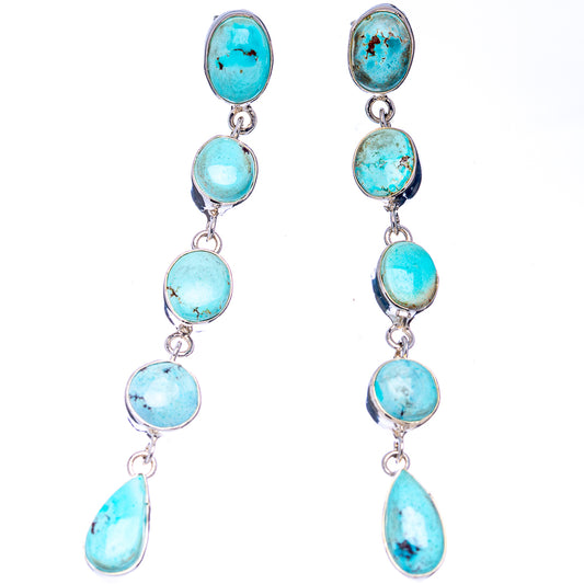 Turquoise oval drop earrings with four stones and teardrop ends on silver hooks