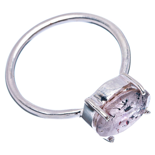 Sterling silver ring with speckled oval gemstone on prongs and smooth polished band