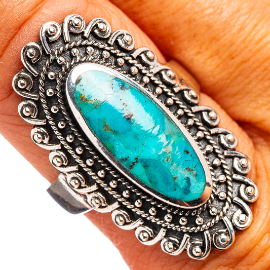 Oval turquoise cabochon sterling silver ring with ornate scroll setting