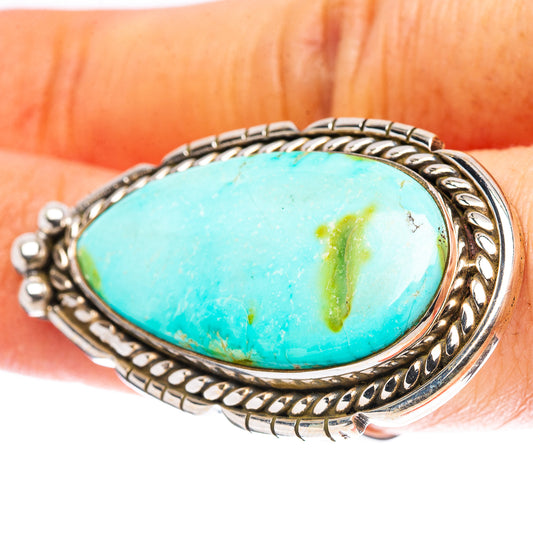 Sterling silver adjustable ring with oval turquoise cabochon and braided rope bezel