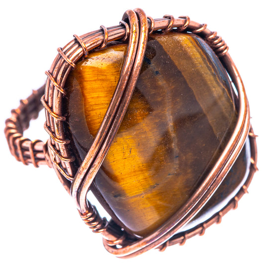 Oxidized copper tiger's eye ring, oval cabochon with golden chatoyancy