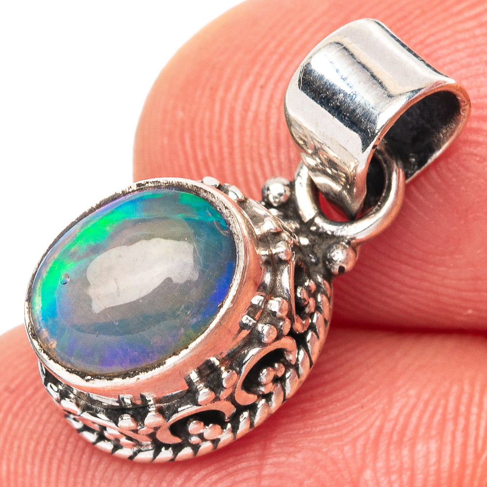 Oval opal pendant in 925 sterling silver, ornate bezel with colorful blue-green stone