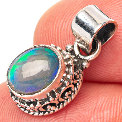 Oval opal pendant in 925 sterling silver, ornate bezel with colorful blue-green stone