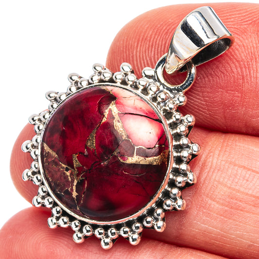 Oval red gemstone pendant with round bead halo and silver bail, .925 sterling silver.