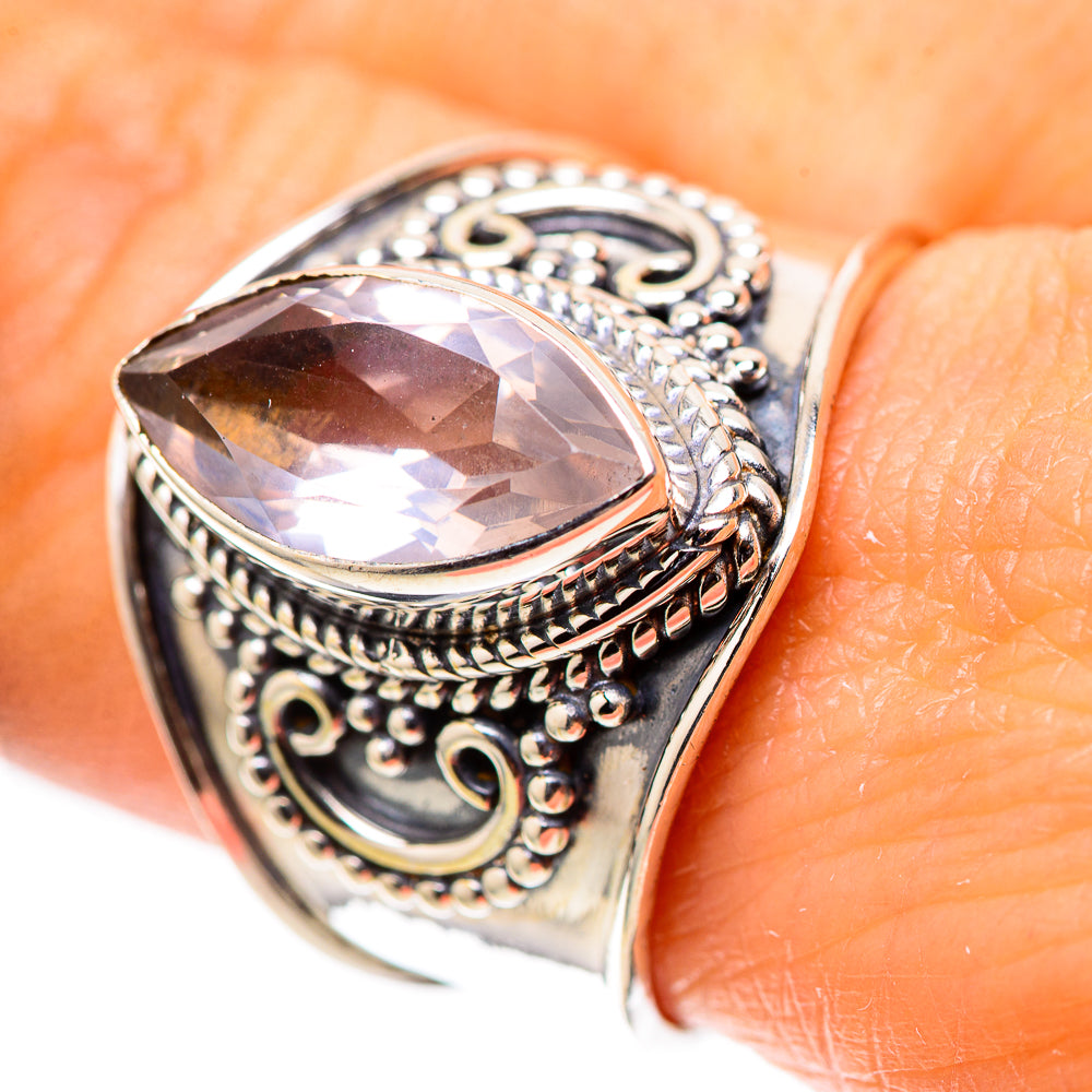Oval rose quartz sterling silver ring with ornate filigree bezel setting