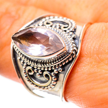 Oval rose quartz sterling silver ring with ornate filigree bezel setting