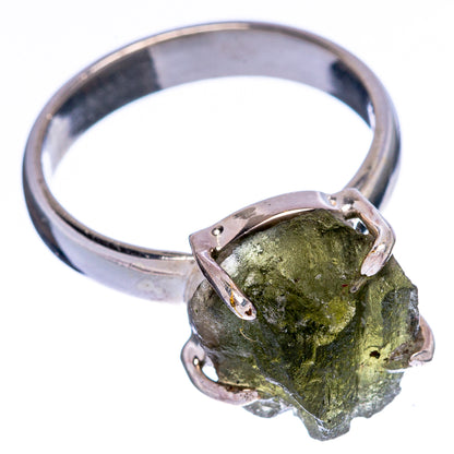 Sterling silver moldavite ring with rough olive-green stone, metal prongs and band