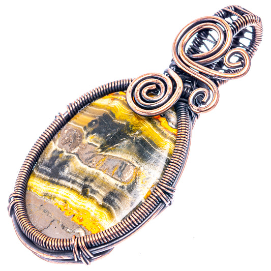 Wire-wrapped oval Bumblebee jasper pendant in oxidized copper, three spiral accents