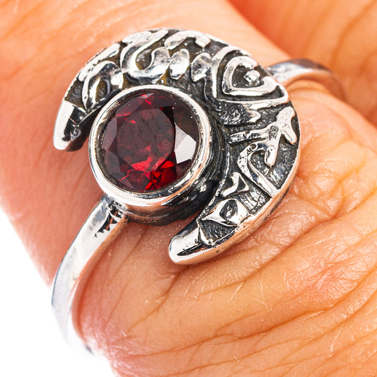 Sterling silver dainty ring with red round gemstone and ornate band detail