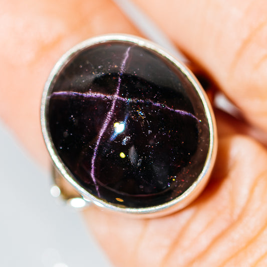 Sterling silver ring with dark star garnet cabochon, bezel setting