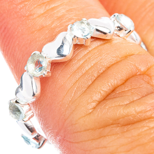 925 sterling silver dainty ring with prong-set blue topaz stones, side view