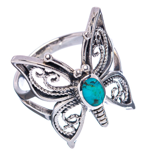 Turquoise oval butterfly ring with silver-tone wings and detailed filigree side view