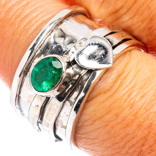 Sterling silver ring with round green gemstone bezel and mirrored heart-style top