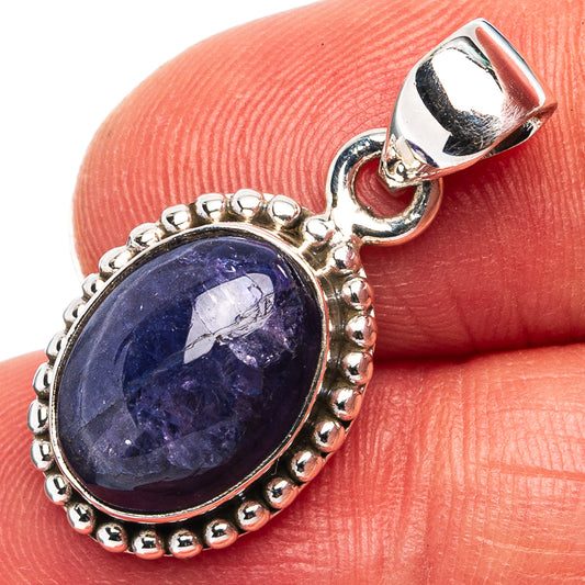 Oval blue gemstone pendant in .925 sterling silver with beaded bezel