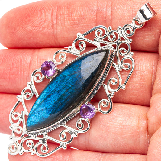 Sterling silver labradorite and amethyst pendant with ornate filigree, oval blue stone