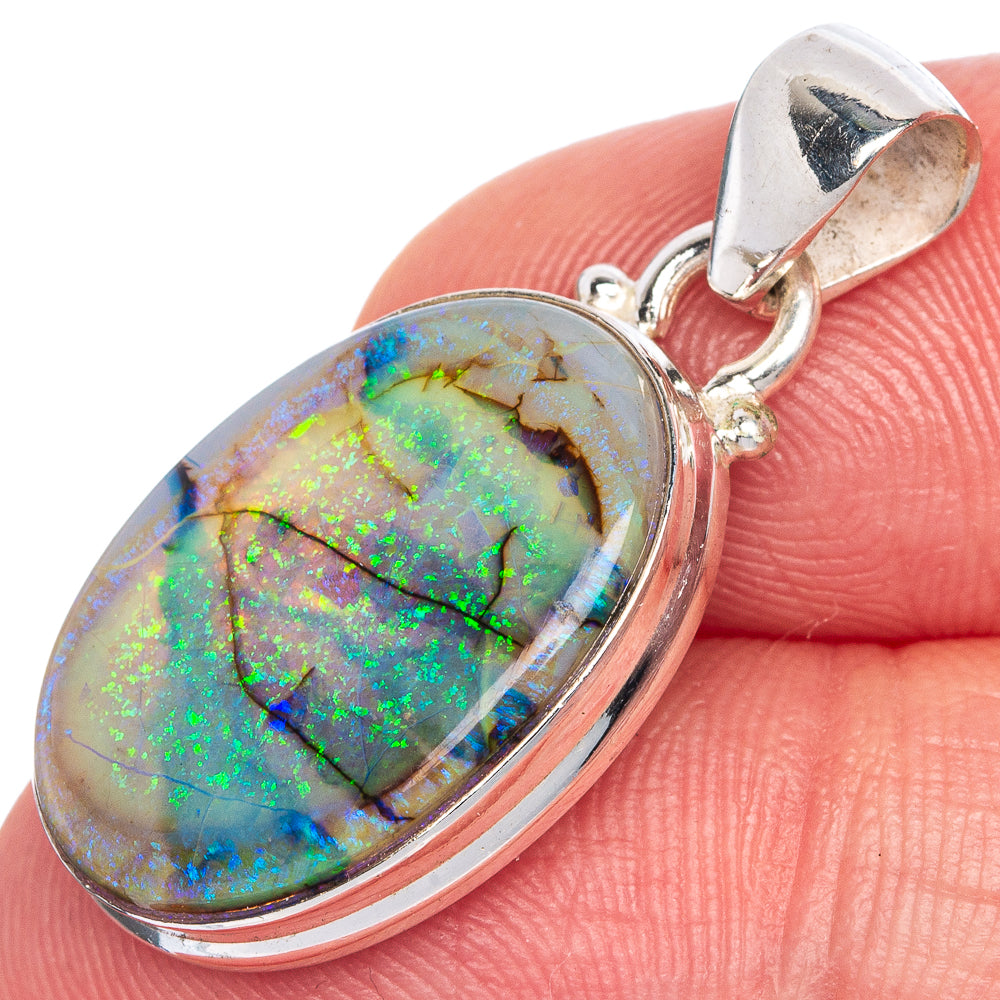 Oval opal pendant in sterling silver bezel with hooked bail and vivid green-blue flashes