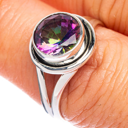 Sterling silver ring with prong-set multicolor gemstone, close-up on finger