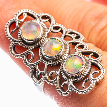 Sterling silver opal ring with three round cabochon stones and ornate filigree setting