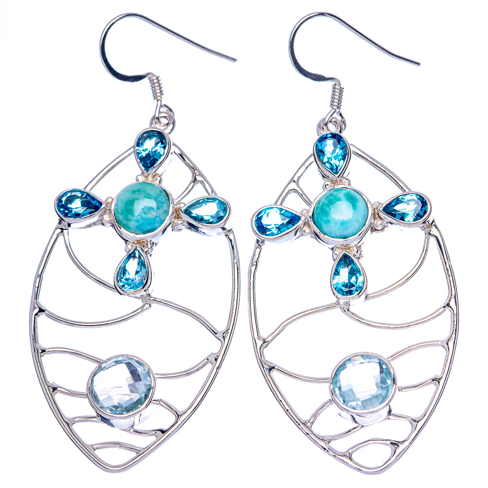 Pair of sterling silver drop earrings with teal center stone and blue accent gemstones