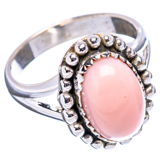 Oval pink gemstone sterling silver ring with scalloped beadwork and raised setting