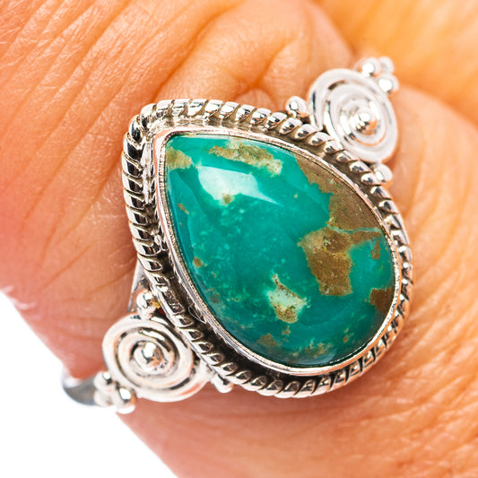 Sterling silver turquoise teardrop ring with ornate rope bezel and swirl details