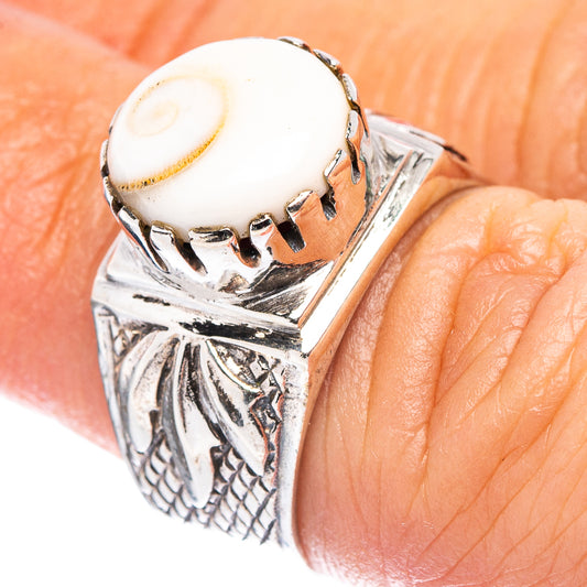Sterling silver filigree ring with white oval cabochon and engraved side panels