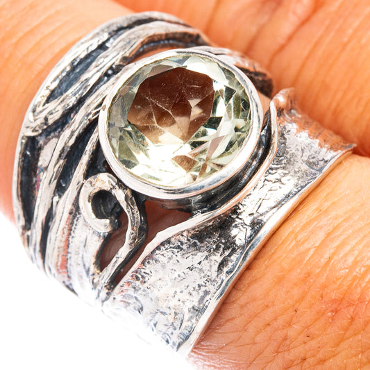 Sterling silver ring with bezel-set green amethyst and ornate swirl band
