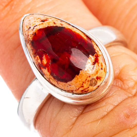 Sterling silver ring with oval red fire opal cabochon, open setting