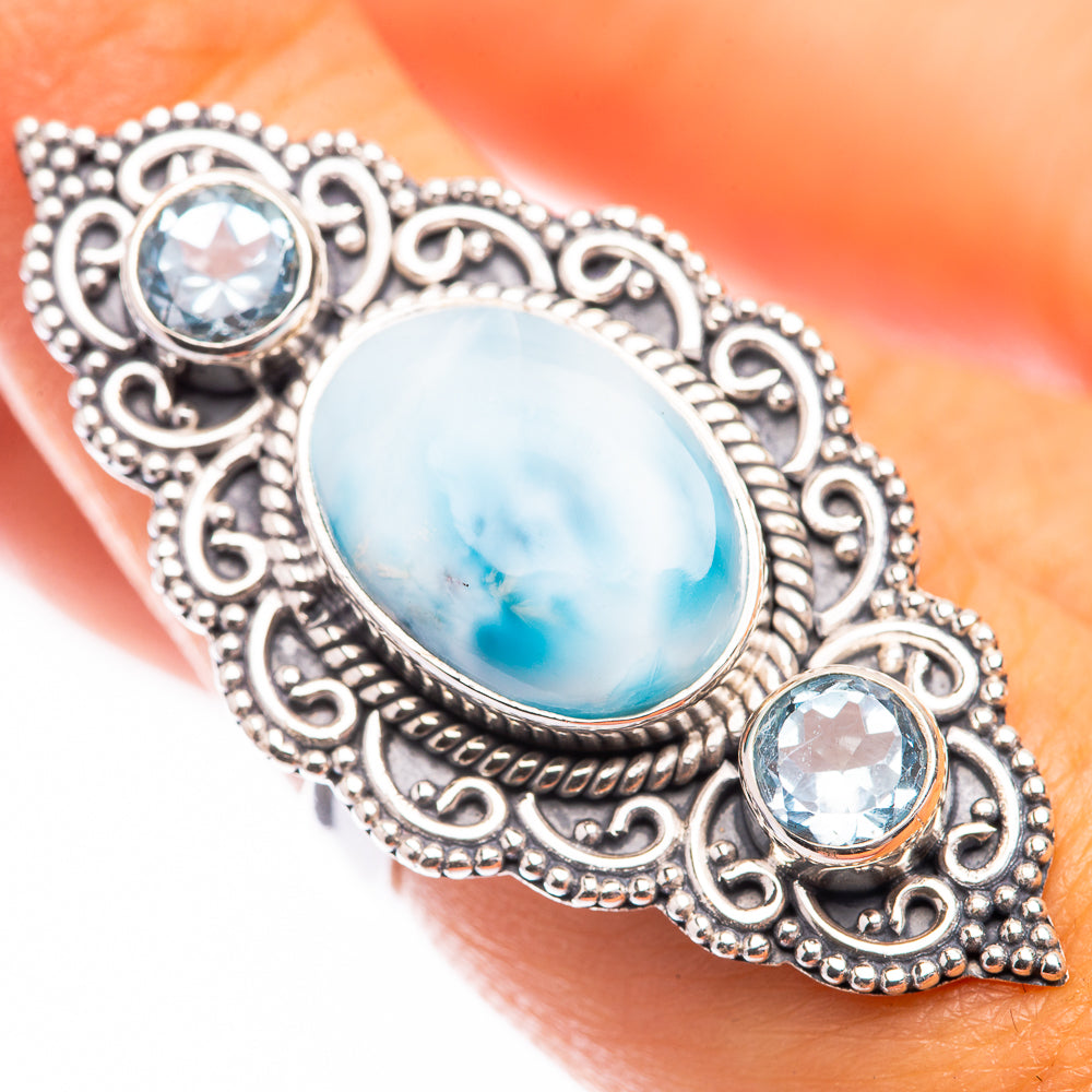 Sterling silver ring with large oval light-blue cabochon and small round blue stones, size 6.5