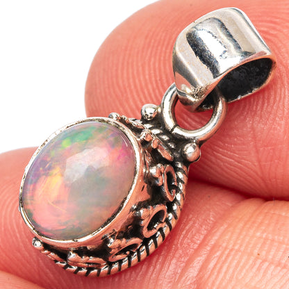 Oval opal pendant, 925 sterling silver with ornate filigree and round bail