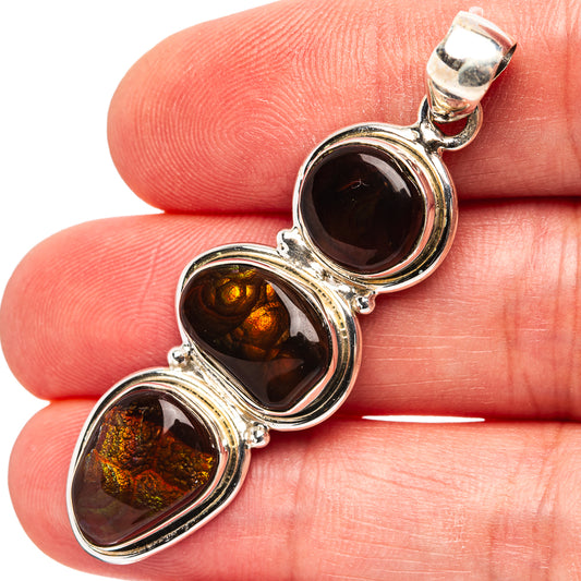 Sterling silver pendant with three dark amber fire agate cabochons, loop bail top