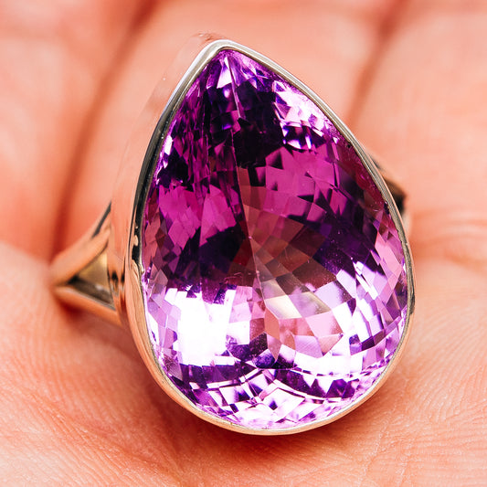 Large faceted amethyst teardrop ring in sterling silver, front view on open band