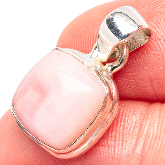 Pink opal pendant in .925 sterling silver bezel with round pink stone, close-up