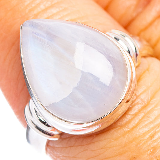 Silver moonstone ring close-up, pear-shaped cabochon with prong-set edges