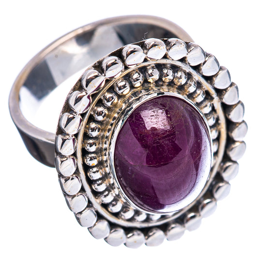 Sterling silver adjustable ring with oval deep purple gemstone, beaded halo border