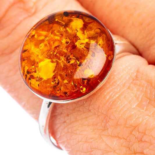 Round amber cabochon set in silver bezel on Baltic amber ring