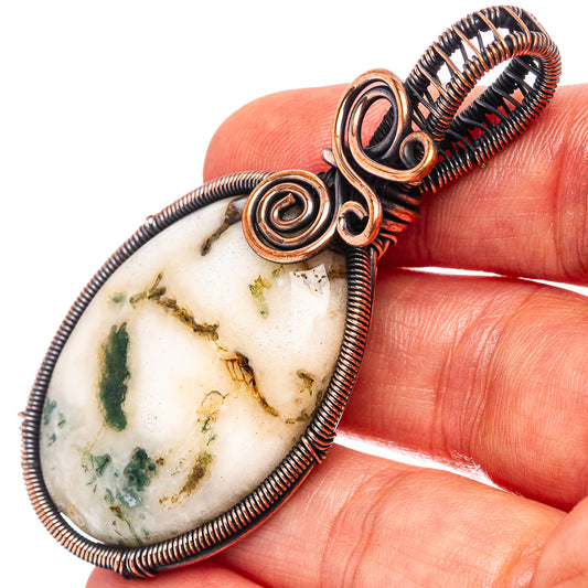 Moss agate teardrop pendant in oxidized copper wire wrap with spiral accents