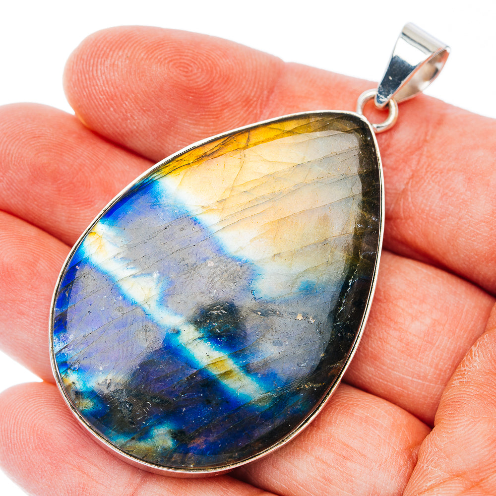 Sterling silver teardrop pendant with blue-gold Spectrolite gemstone