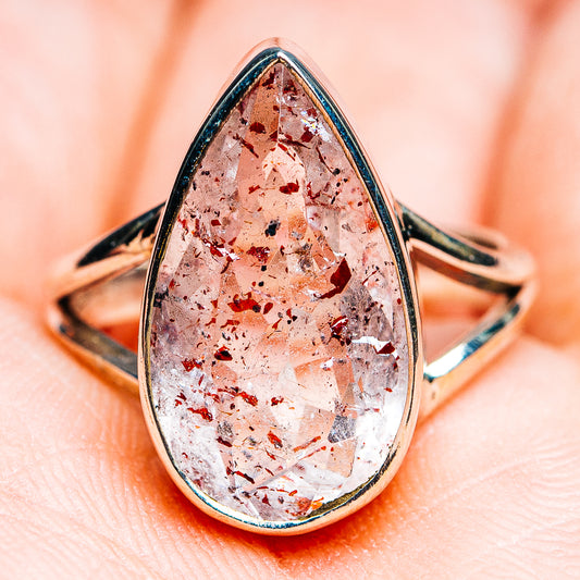 Sterling silver teardrop lepidocrocite ring with faceted red-pink stone, bezel-set