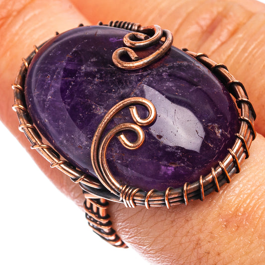 Oxidized copper wire wrap ring with oval amethyst cabochon, scroll accents