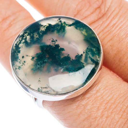 Round moss agate sterling silver ring on hand, green dendrite pattern in translucent stone