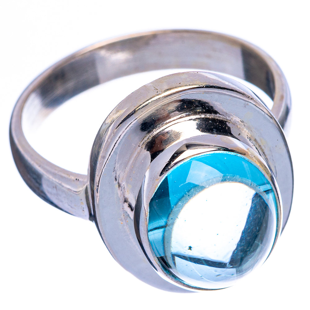 Sterling silver ring with oval aquamarine gemstone set in rounded bezel