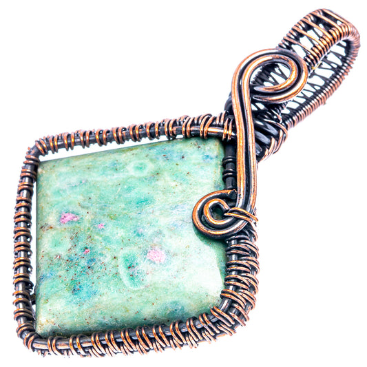Oxidized copper wire-wrap pendant with square green stone and pink flecks, round bail