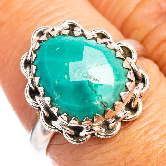 Sterling silver turquoise ring with oval green stone and ornate prong setting
